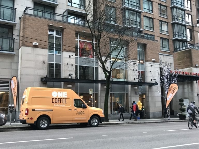 OneCoffee Delivery Truck outside Building